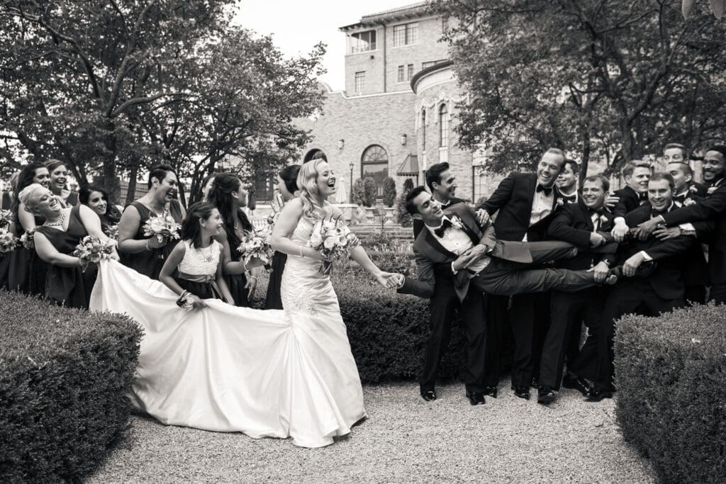 Groomsmen pick up the groom with the bridal party at Hotel Baker.