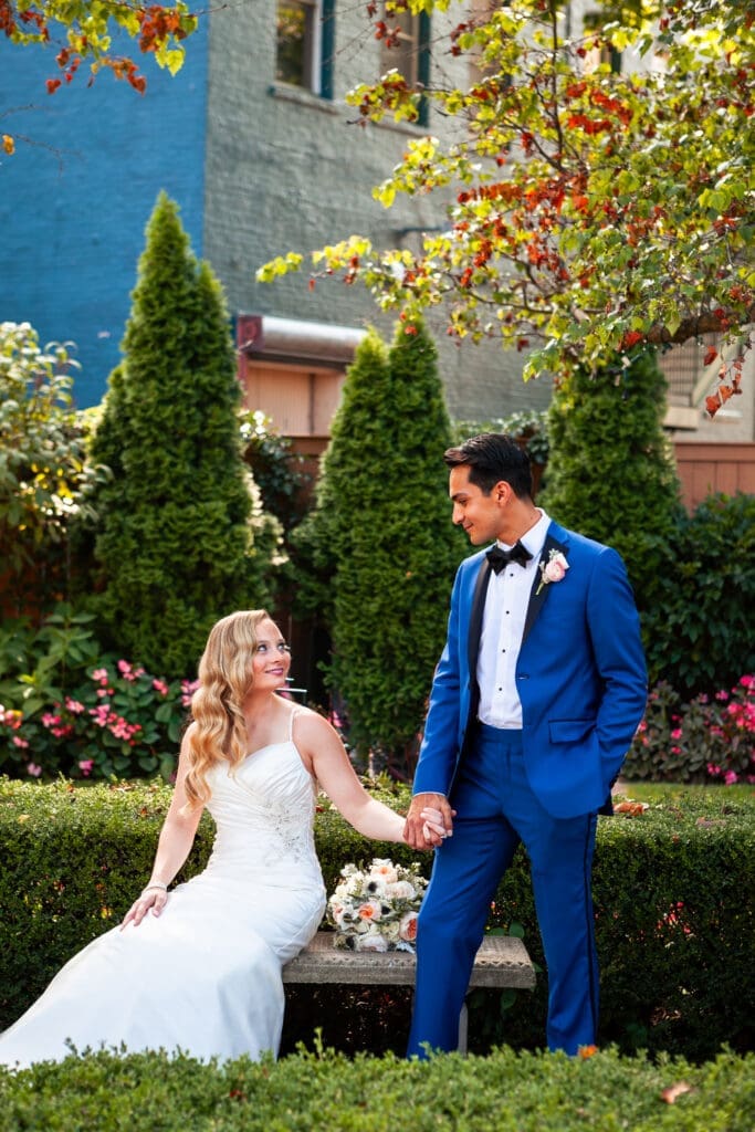 Bride and groom looking at each other and smiling on their wedding day at Hotel Baker.