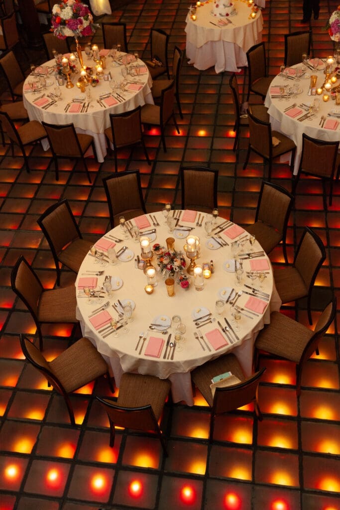 Light-up dancefloor and guest tables at a luxury wedding in St. Charles at Hotel Baker.