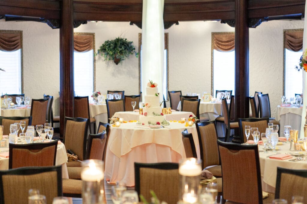A perfect luxury wedding cake displayed in the Rainbow Room at Hotel Baker.