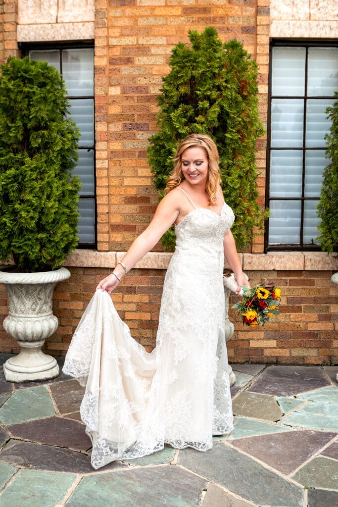 Bride holding out her dress at Hotel Baker St. Charles.