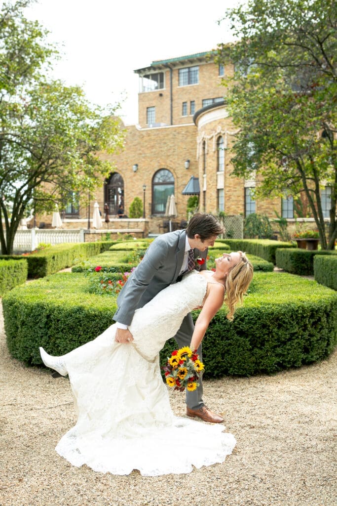 Groom dipping bride at Hotel Baker.