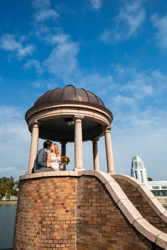 Bride and groom kissing in the gazebo at Hotel Baker by the Fox River.