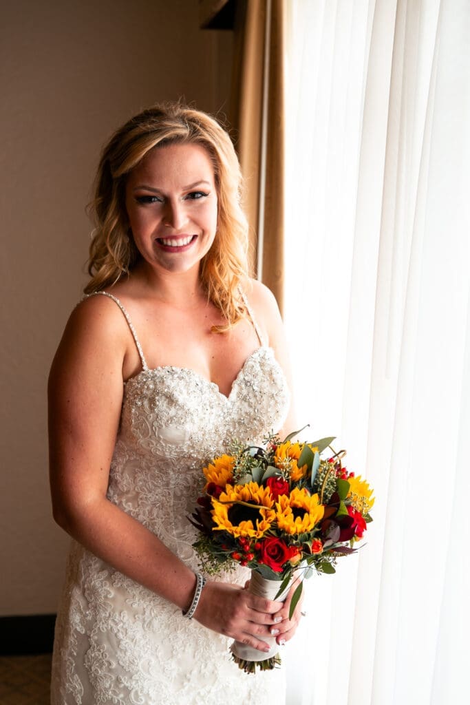 Bride posing for the best St. Charles wedding photographer Joe Nowak at Hotel Baker.