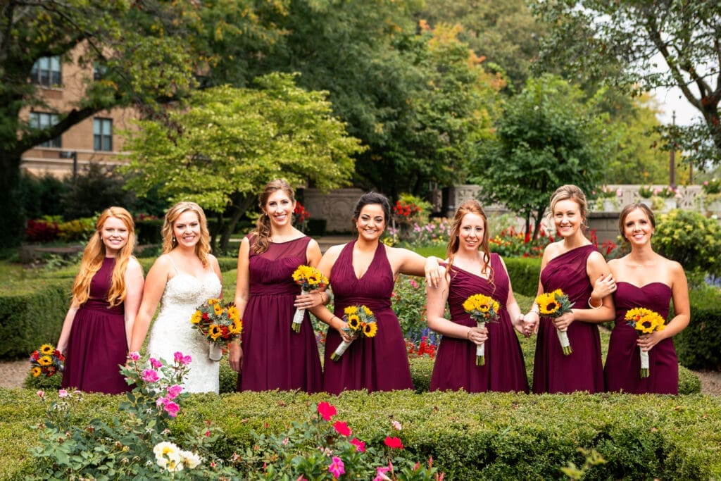 Bride and her bridesmaids in the English Garden at Hotel Baker.