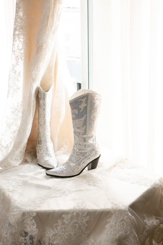 Bridal cowboy boots in the window at the bridal suite in Hotel Baker.