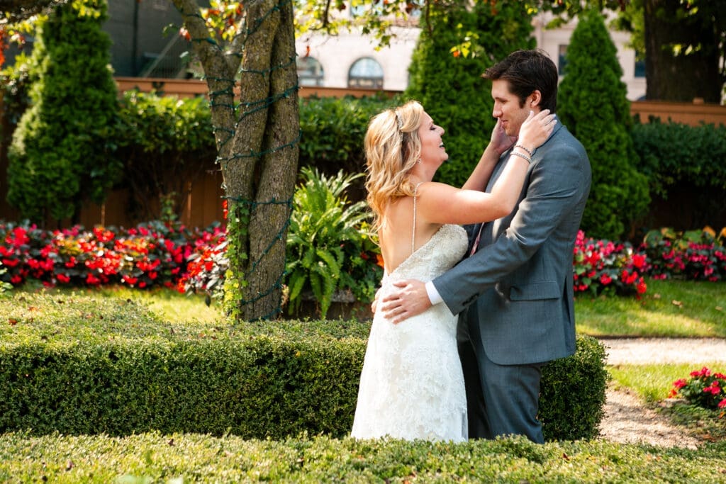 Bride and groom first look in the English garden at Hotel Baker St. Charles IL