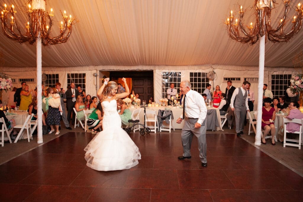 Bride and her father dancing on the dancefloor together at a private estate wedding reception in Chicago.
