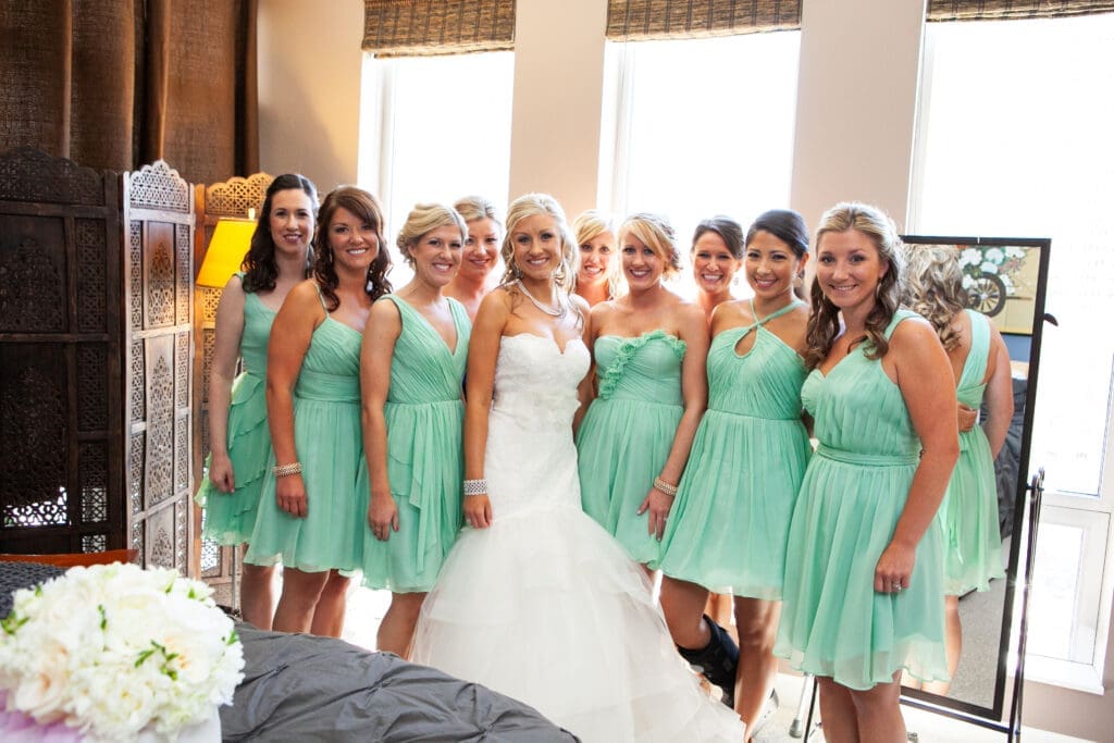 Bride and bridesmaids smiling after getting ready at the Langham Chicago.