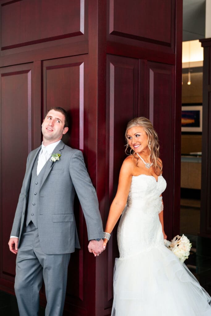 Bride and groom talking to each other before their first look at the Langham Chicago.
