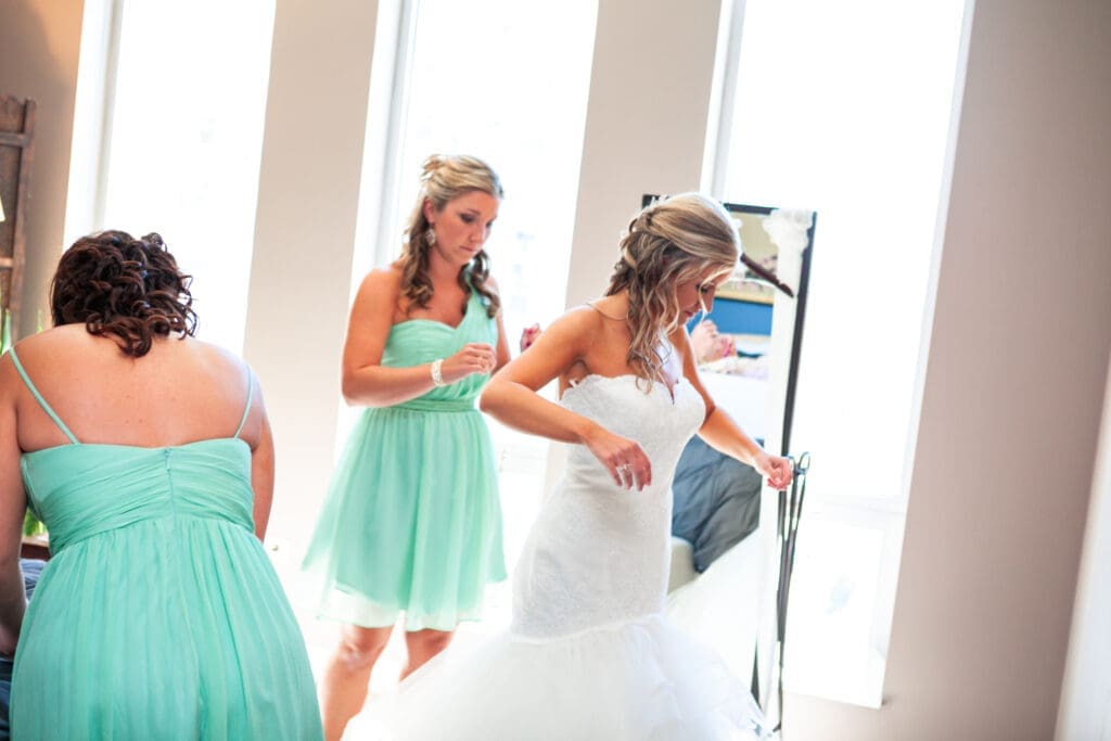Bride in bridal suite Langham hotel Chicago with her bridesmaids getting ready.