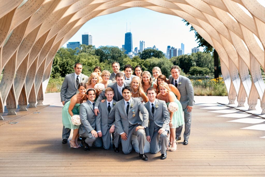 Entire bridal party at Lincoln Park Zoo with Chicago skyline in the background.